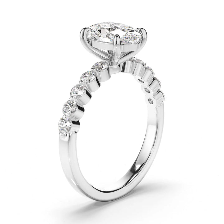 Oval engagement ring with round diamond band